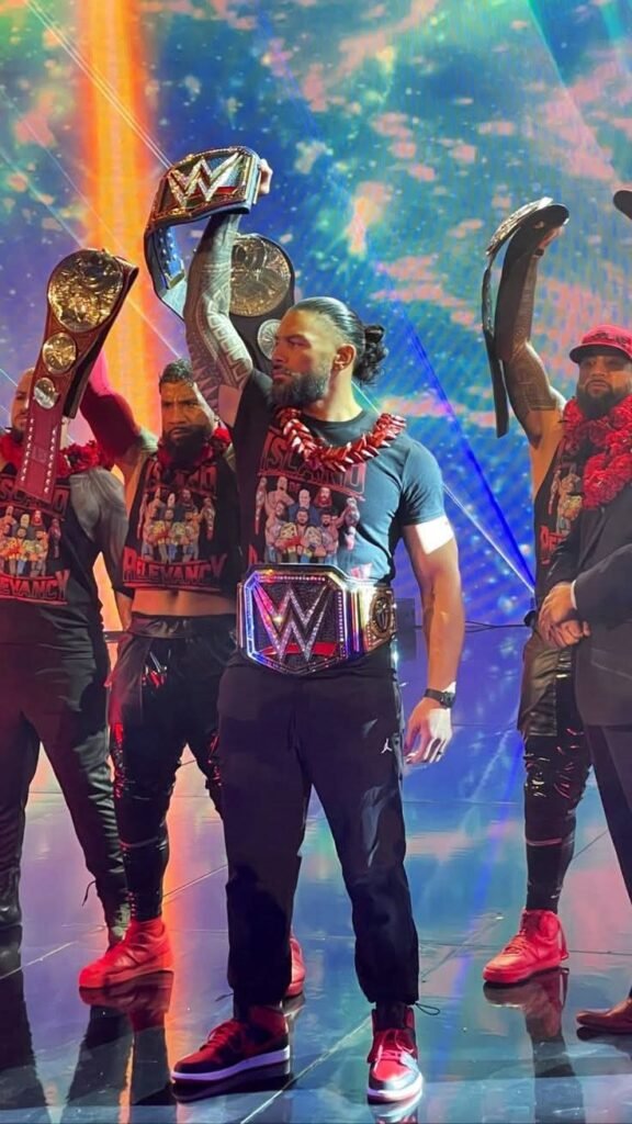 A powerful wrestling group standing  with championship belts. This is unity and power ⭐ #WWE #RomanReigns #viralpost2025
