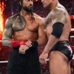 Electric tension fills the arena as two titans stand face to face,