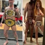 CM Punk copying Seth Rollins and Becky Lynch’s iconic title photo 🤣🤣🤣